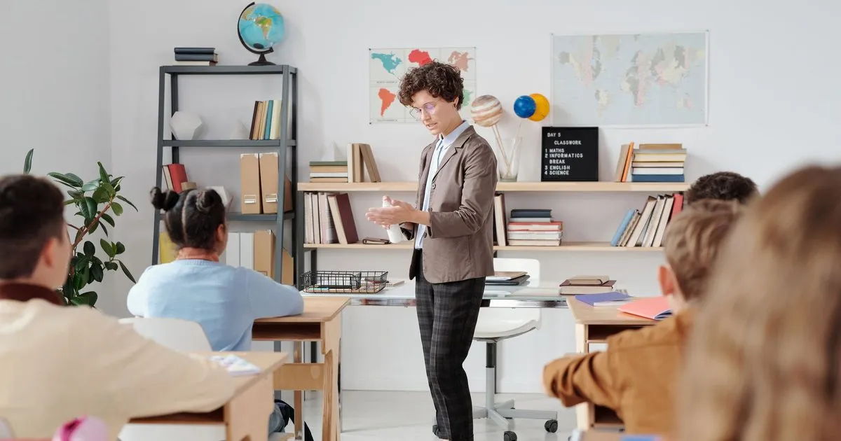 A teacher leading a lesson in a bright classroom